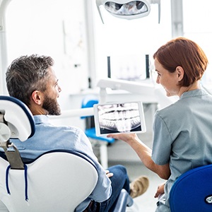 Man talking to dentist about X-rays