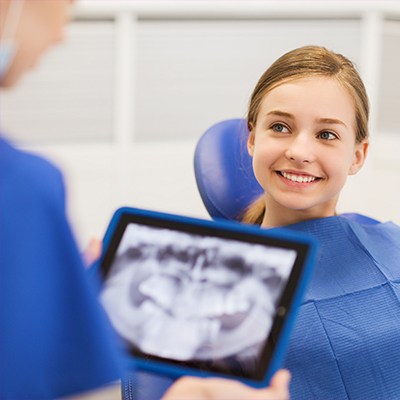 young girl smiling at dentist