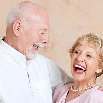 husband and wife laughing
