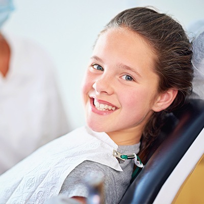 girl getting fluoride treatment