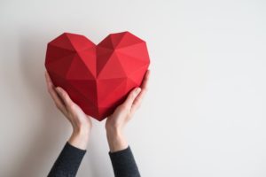 person holding crafted heart