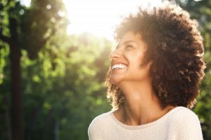 woman smiling in the sun