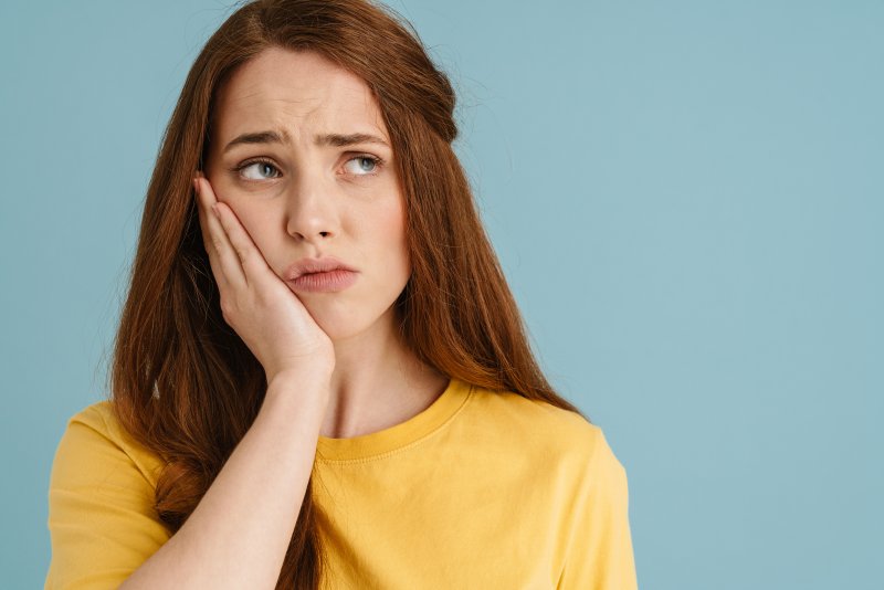 Woman wondering about her toothache