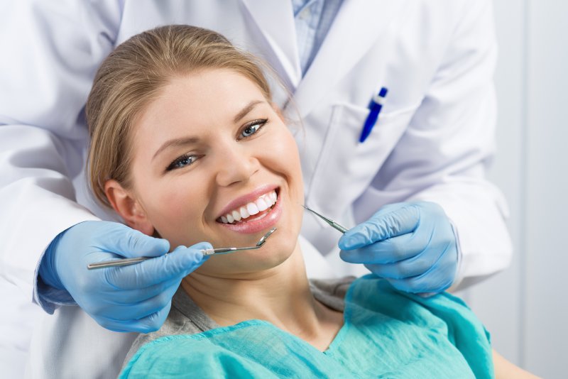 woman smiling after getting dental crown in Haverhill