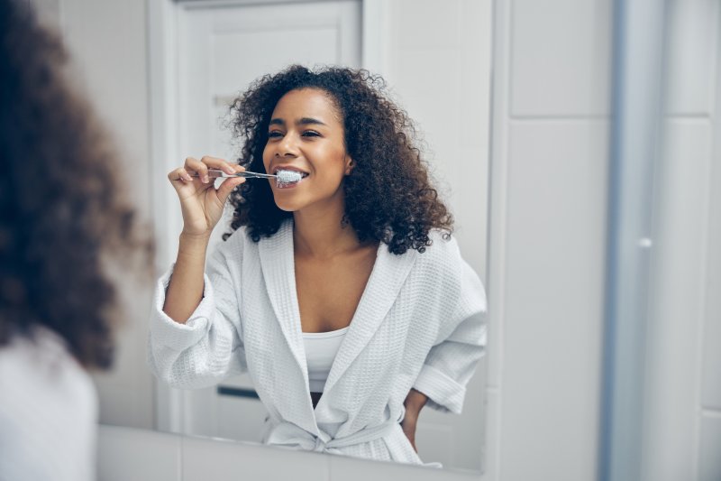 woman brushing teeth